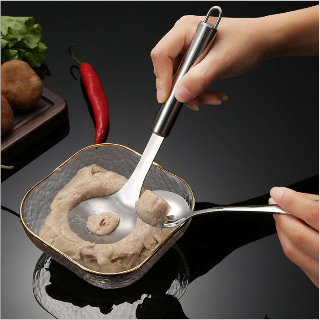 Multi functional spoon. Made from stainless steel and suitable for making meatball